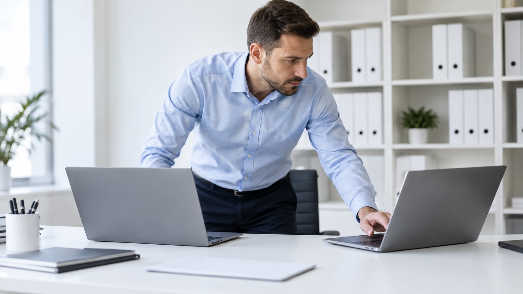 Preparation of two company laptops in the office